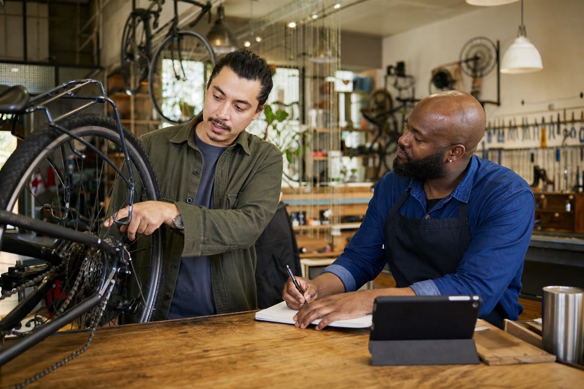 A bicycle prepared for inspection on a workshop repair stand