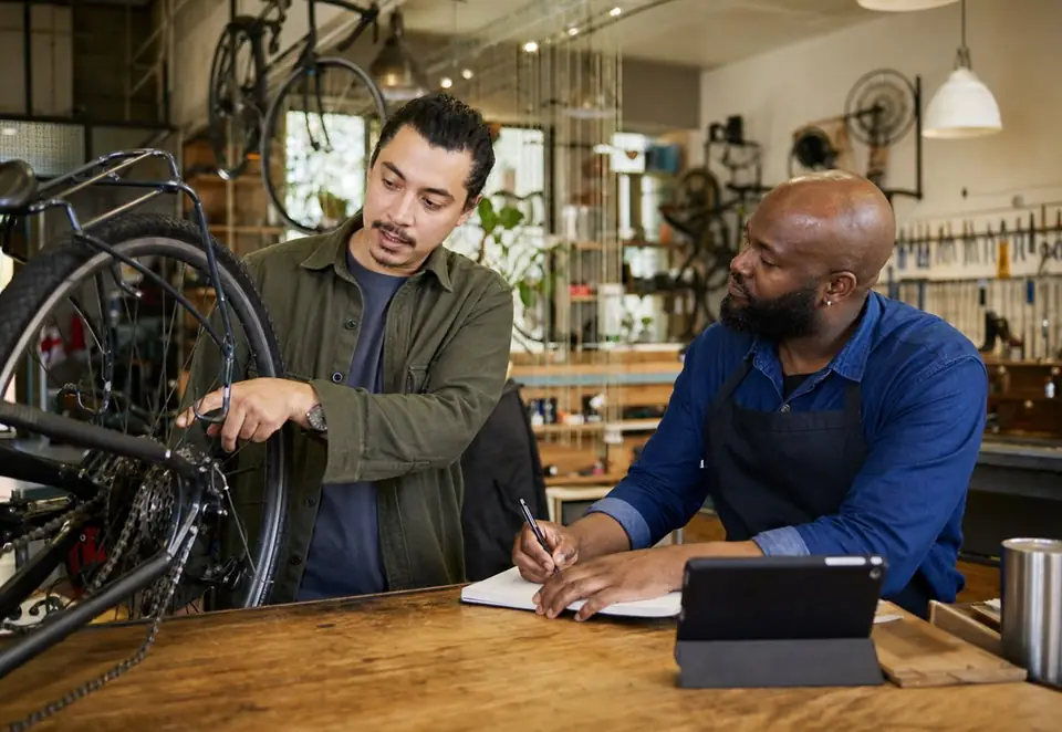 A bicycle prepared for inspection on a workshop repair stand